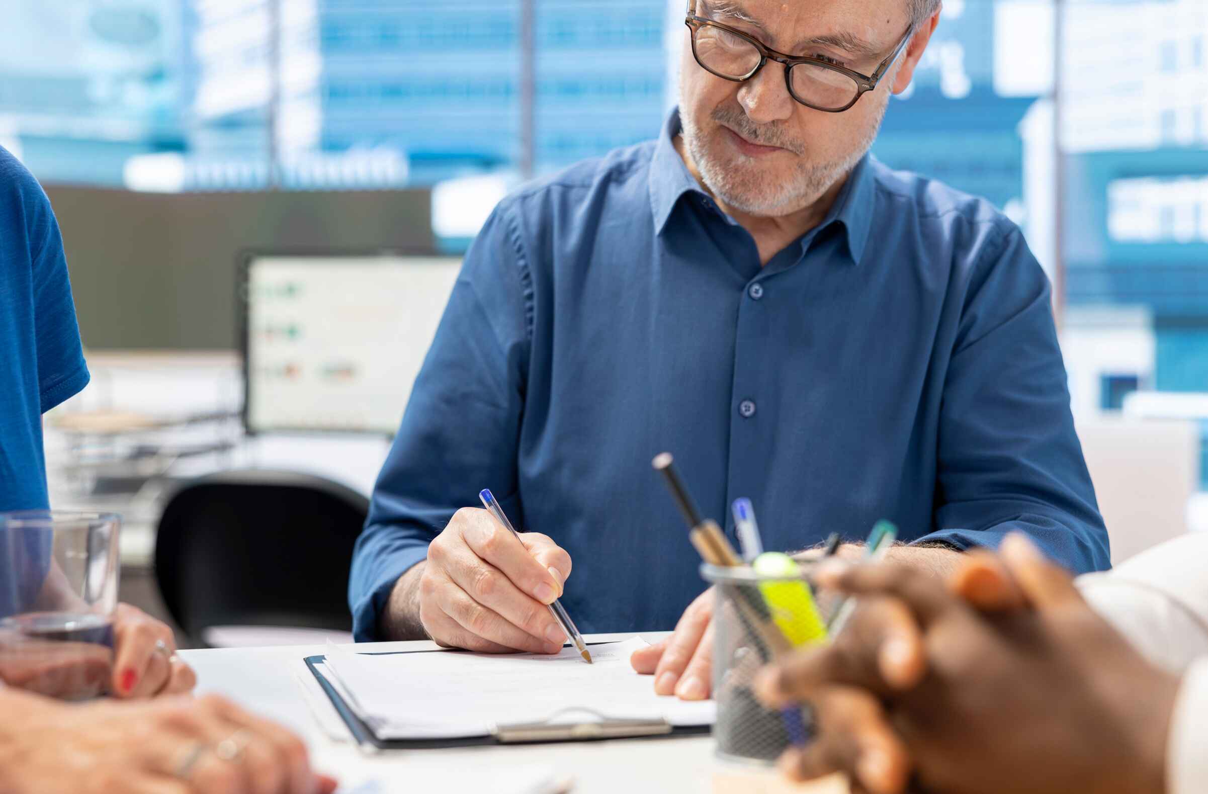 Commercial banker guiding client through exit strategy process
