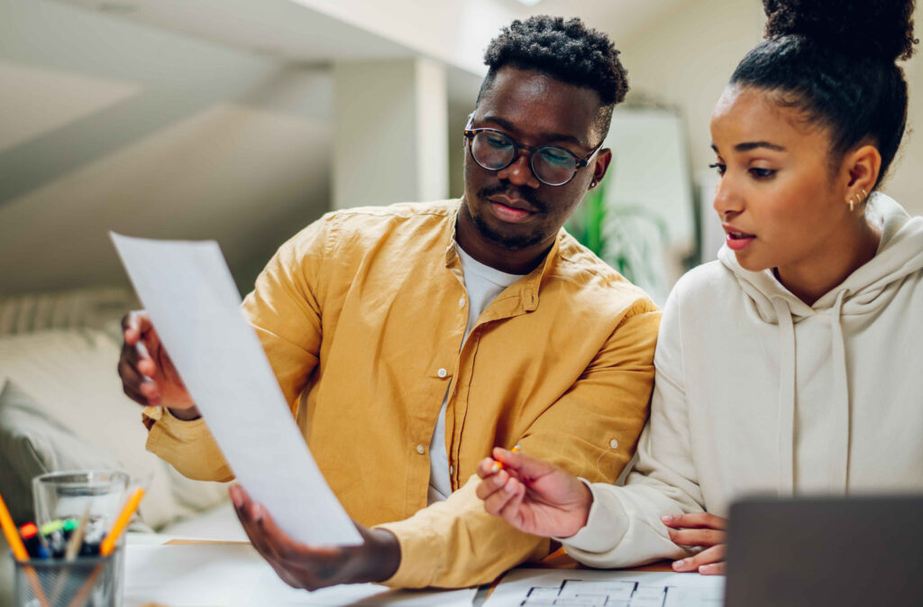 Business owner reviewing cash flow plan during delayed client payments