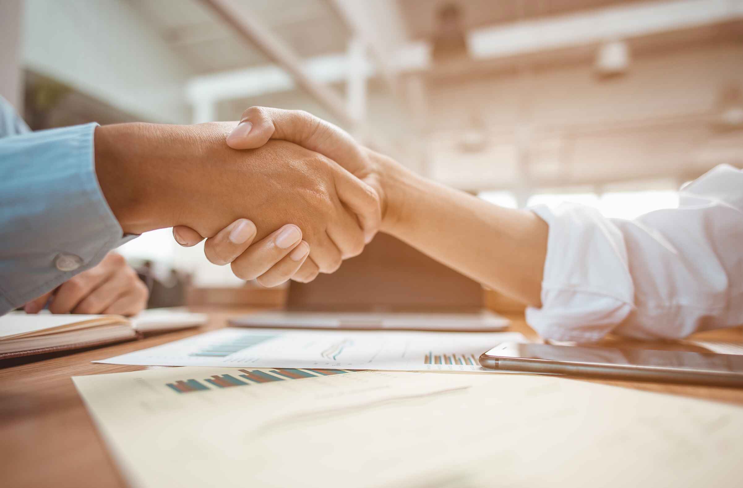 Business owner meeting with lender to build trust and secure financing.