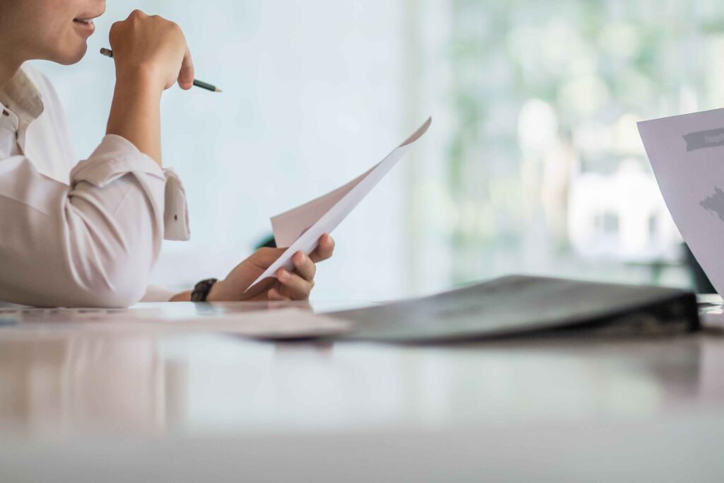 Lender assessing financial documents to evaluate an asset-based loan application