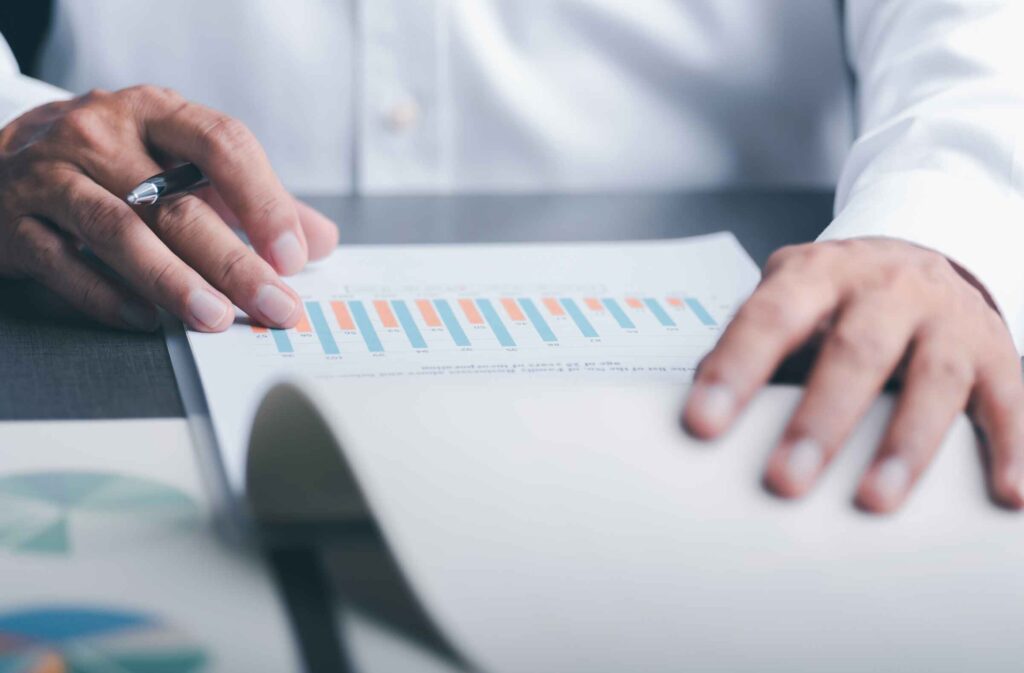Lender reviewing documents for asset-based lending collateral transition