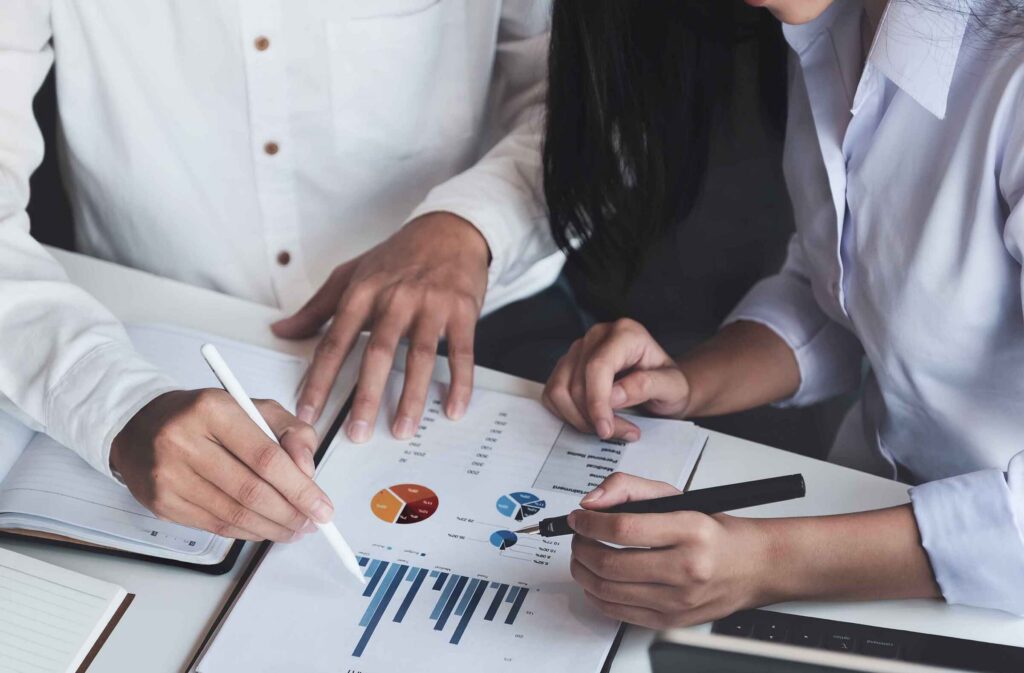 Finance team reviewing financial reports as part of proactive credit risk management strategy