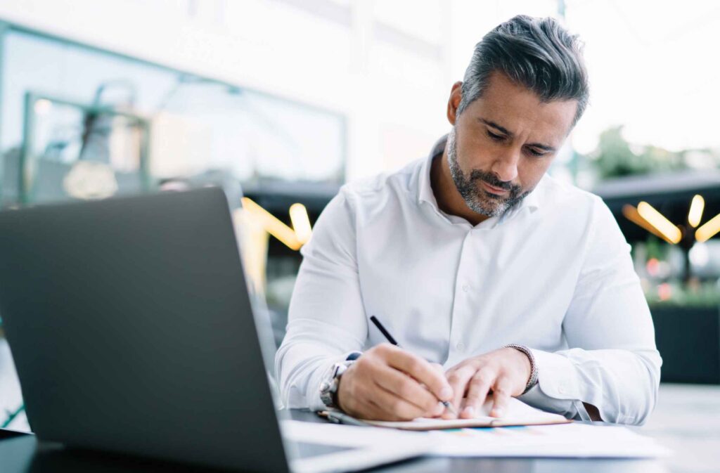 Business owner reviewing accounts receivable report for cash flow insights