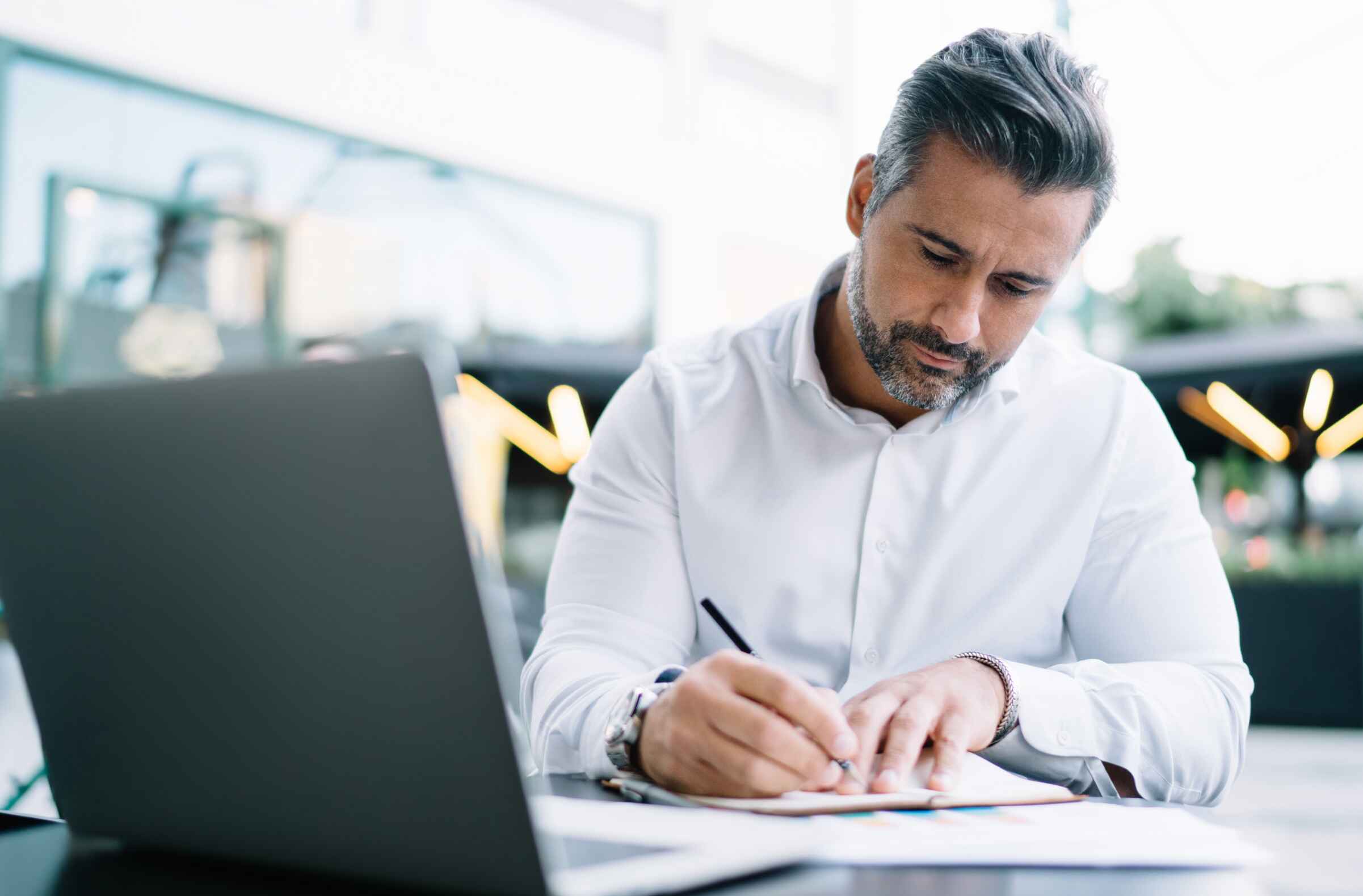 Business owner reviewing accounts receivable report for cash flow insights